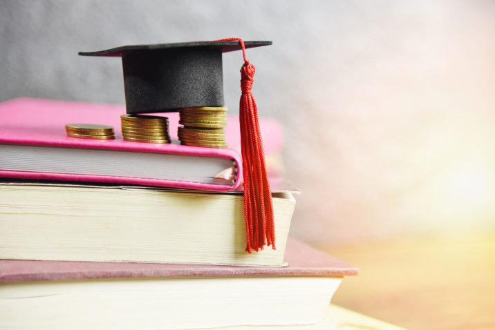 Grad cap and books