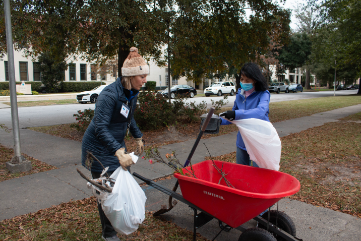 two people with a wheelbarrow