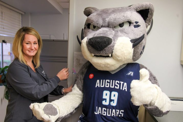 Photo of AU mascot Augustus getting a mock flu shot