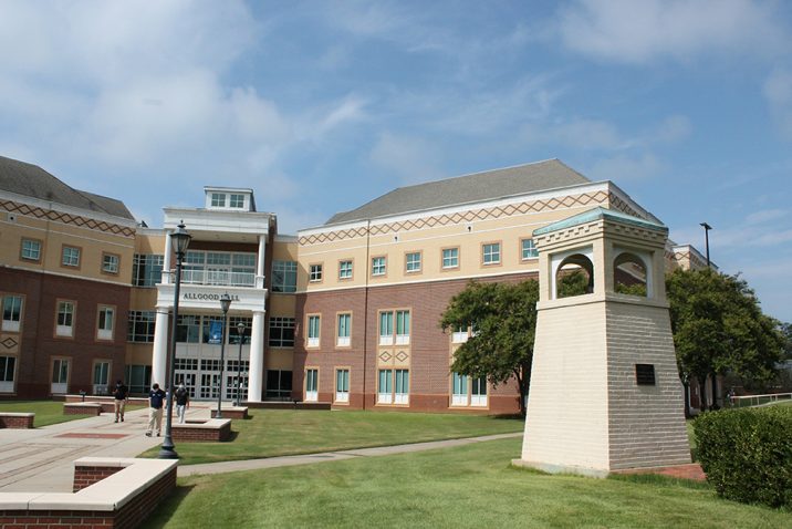Belltower standing in front of a building
