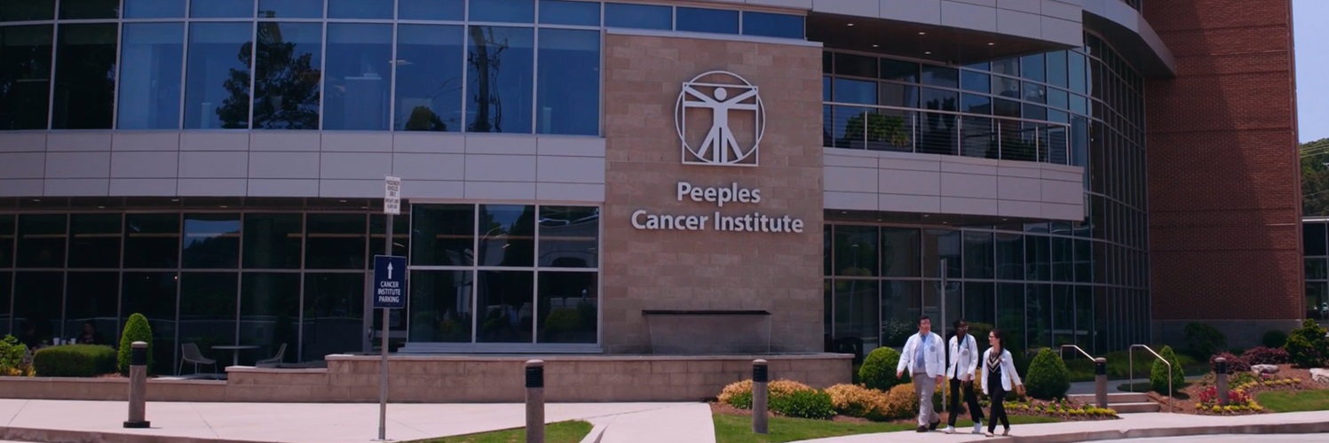 Peeples Cancer Institute with students walking in the front