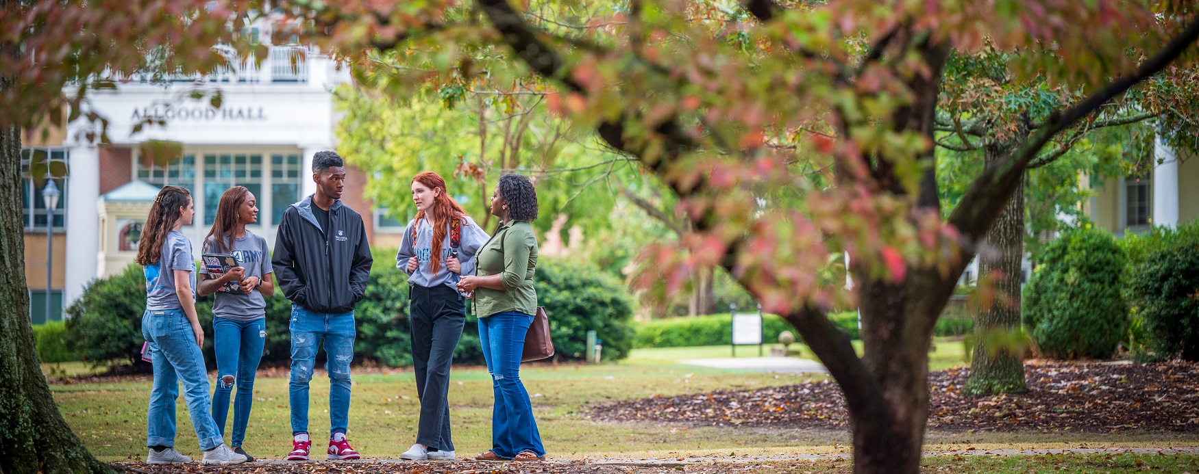 students talk together outside