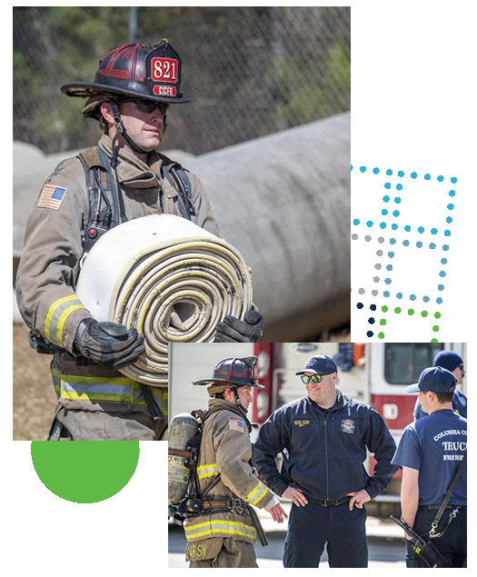 Firefighter with hose, instructor with firefighters