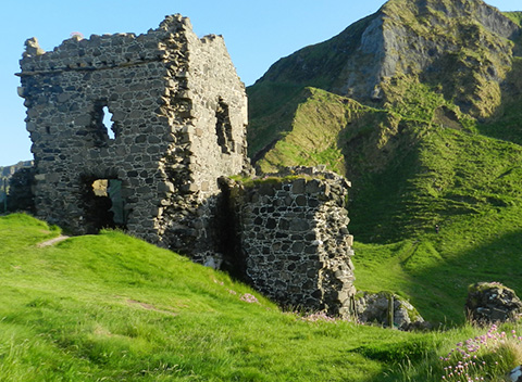 Ruins among green hills in Ireland