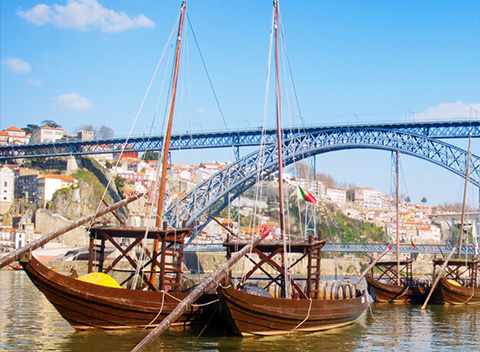 Sailboats near a high bridge in Portugal